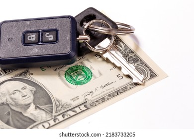 Car Keys And Keychain Alarm On One Dollar Banknote