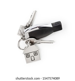 Car Keys Keychain And House Shaped Key Fob Isolated On White Background Clipping Path Included. Design Element, Top View, Flat Lay. Real Estate And Insurance Concept
