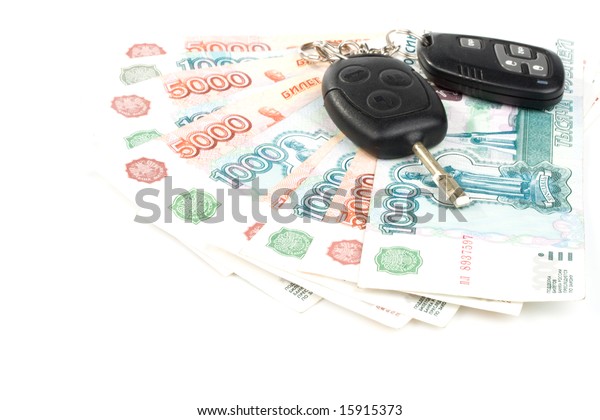 Car keys and money\
on a white background
