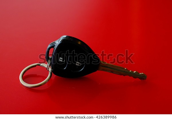 Car Keys on red\
background