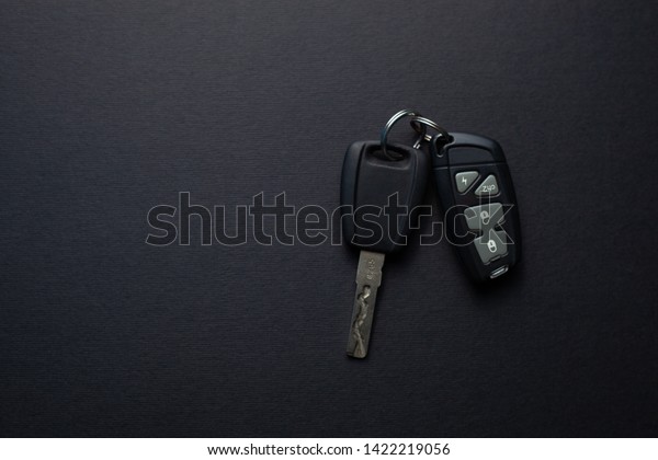 Car keys with remote from car alarm on\
isolated black background