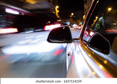 Car Light Trail While Driving In The Coty By Night