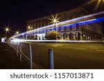 Car light trails at night passing in front of the mairie (mayor