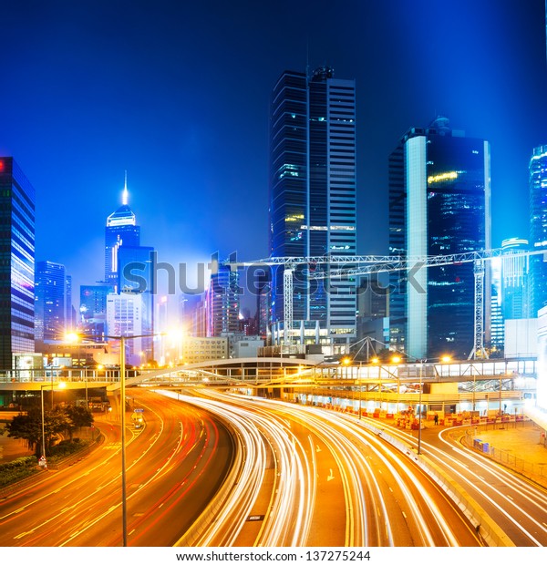 Car light\
trails and urban landscape in Hong\
Kong