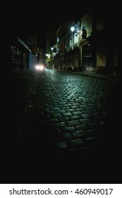 Car Lights Down Empty Dark Alley At Night