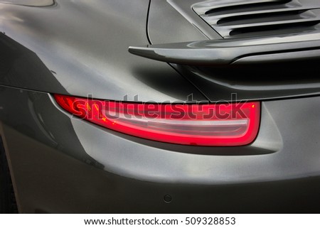 Car lights. Gray car. Luxury taillights
