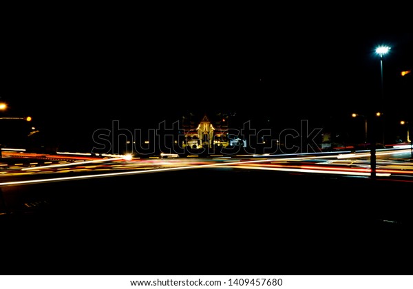 Car lights running at\
night