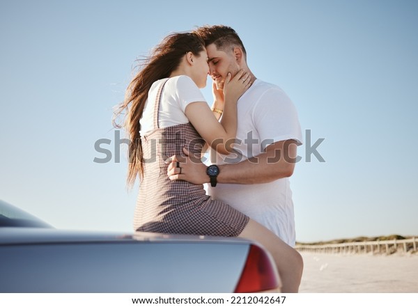 Car, love and couple on a road trip in summer on\
a holiday vacation for bonding, romance and romantic honeymoon.\
Travel, freedom and young woman holding her partner outdoors\
enjoying their weekend