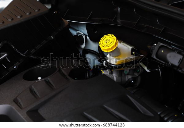 Car\
maintenance, Close up of brake fluid\
tank