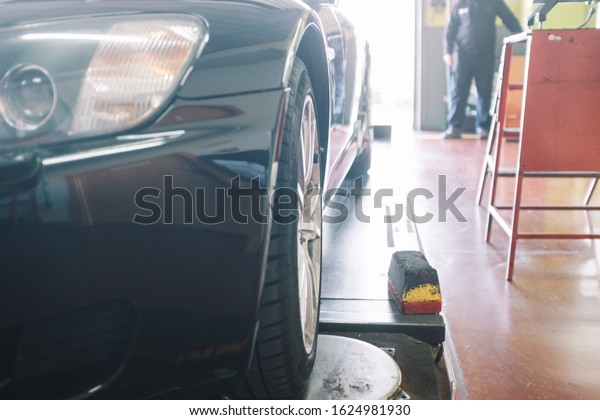 Car maintenance in mechanical\
workshop.Focus selective. Concept car repair,\
maintenance
