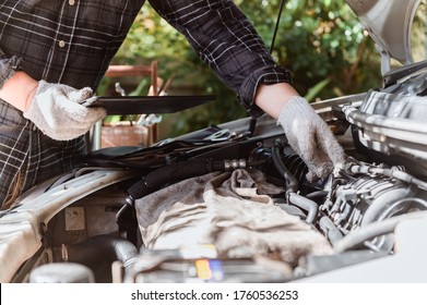 Car Maintenance. Men At Work From Home. Auto Mechanic Repair Engine. Social Distancing And New Normal Lifestyle.