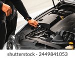 Car maintenance and repair. Car service. Breakdown on the road. Open hood. Engine compartment. Car engine and other components and assemblies. Technological modern car.