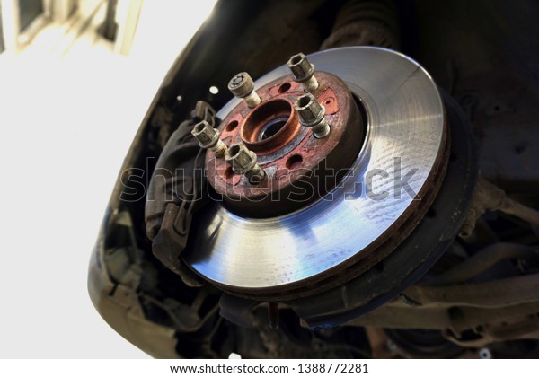 
Car maintenance series: Closeup of car disc
brake. Maintenance and repair of the car in a modern technical
center.                              
