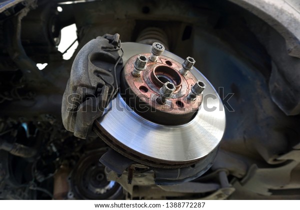 
Car maintenance series: Closeup of car disc
brake. Maintenance and repair of the car in a modern technical
center.                              
