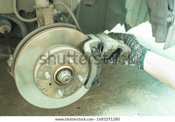 Car maintenance\
service, Checking car disc brake and change disc plate. Auto\
mechanic maintenance brake\
system.