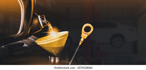 Car maintenance service , Engine oil pouring to funnel for engine maintenance , copy space on black background for text , Double exposure , Automobile repair shop business concept - Powered by Shutterstock