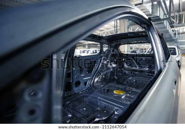 Car\
manufacturing plant, ready-to-paint car\
body