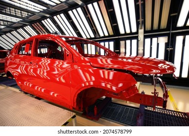 Car Manufacturing Plant, Red Cars On The Paint Line