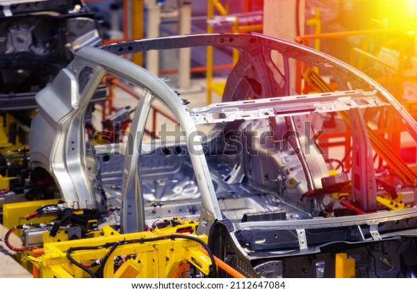 Car\
manufacturing plant, robotic welding\
line