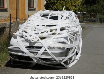 car masked in the toilet paper as funny game