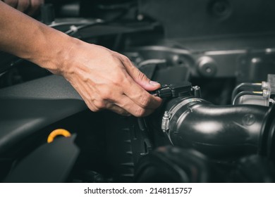 Car mass air flow sensor in the engine room. Car maintenance concept. - Shutterstock ID 2148115757