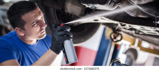 Car Master Mechanic Repairer Lubricates The Screws With A Machine Parts Cleaner Oil Dirt Grease Aerosol Spray For Lubrication