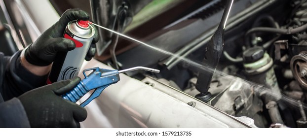 Car Master Mechanic Repairer Lubricates The Screws With A Machine Parts Cleaner Oil Dirt Grease Aerosol Spray For Lubrication