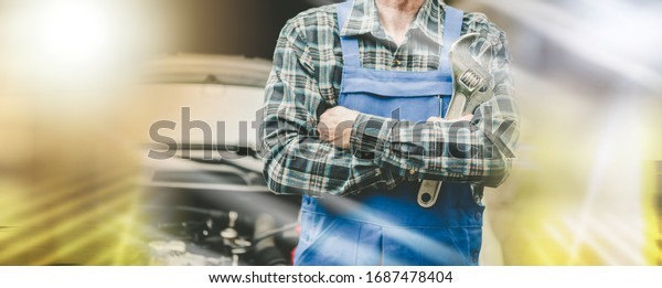 Car mechanic\
with arm crossed; multiple\
exposure