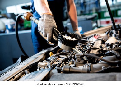 Car Mechanic Change Engine Oil. Car Repair. Service Station