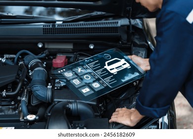 Car mechanic checking customer service concept With laptop tools about car diagnostics in technology To check the system for quality - Powered by Shutterstock