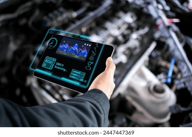 Car mechanic checking ECU electronic control unit with OBD or OBD2 wireless scanner tool , car information showing on screen interface , Car maintenance service concept - Powered by Shutterstock