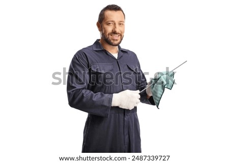 Car mechanic cleaning a dipstick for car engine oil check isolated on white background