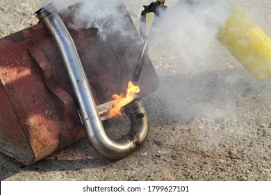 Car Mechanic Cleaning Steel EGR Intake Pipe, Burning Carbon In  Exhaust Gas Recirculation Tube, Worker Using Propane Torch