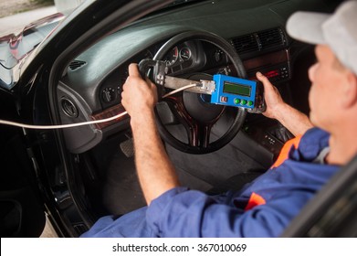 Car Mechanic Diagnosis Of The Steering In Auto Repair Service. Details Shot