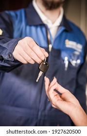 Car Mechanic Handing Over Car Keys