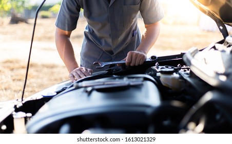 Car mechanic has checked the condition of the engine in wrench, Car repair service concept. - Shutterstock ID 1613021329