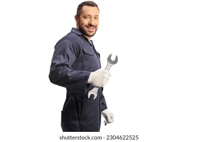 Car mechanic holding a wrench and looking over shoulder isolated on white background