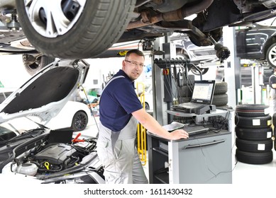 Car Mechanic Maintains Vehicle Help Diagnostic Stock Photo 1611430432 ...