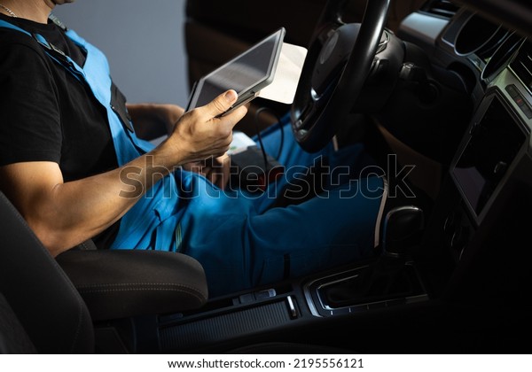 Car mechanic maintains the vehicle\
with the help of diagnostic modern computer equipment. Car service\
manager uses tablet computer with diagnostics\
software.