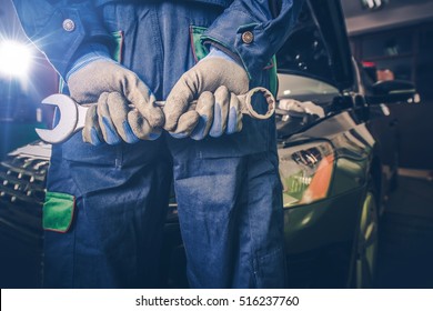 Car Mechanic Ready For Work. Auto Mechanic With Large Wrench In Hands. 