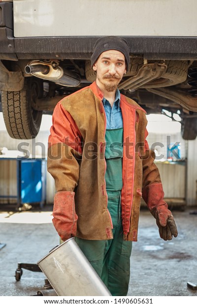 car mechanic repairs\
the exhaust pipe