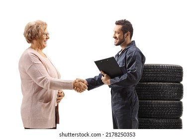 Car Mechanic Shaking Hand With An Elderly Woman Isolated On White Background