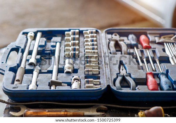 \
Car mechanic tool kit in\
garage
