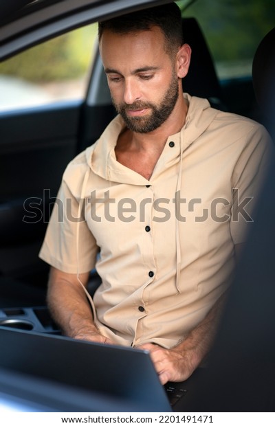 Car mechanic using laptop computer
making car diagnostic. Repair, car service concept
	