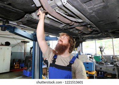 Car mechanic at work - Shutterstock ID 1221513601
