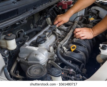 Car mechanic working in auto repair service - Shutterstock ID 1061480717