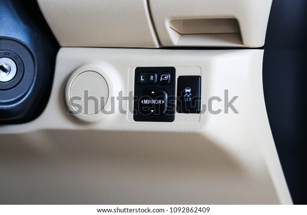 Car mirror button. Front and back electric mirror\
buttons-lower or close car windows. Adjustable folding mirrors left\
and right.