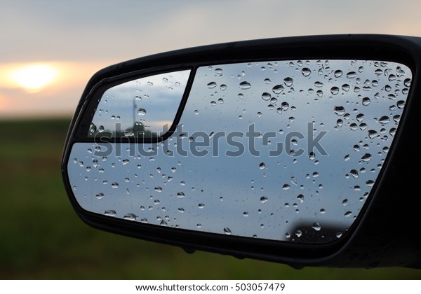 Car Mirror In\
Rain