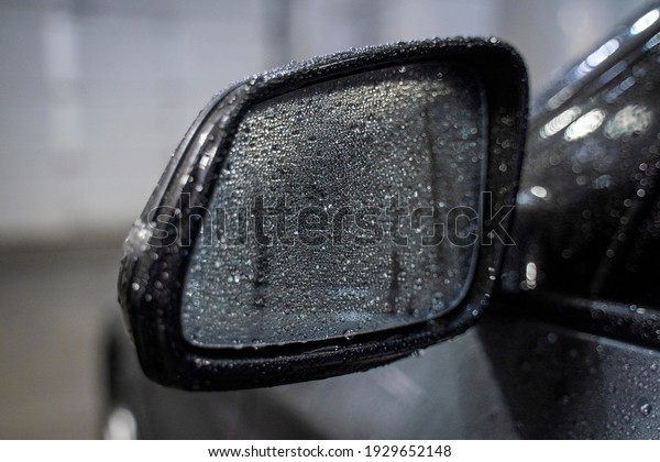 car mirror in water\
drops