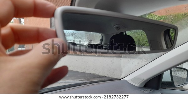 Car mirror while driving\
in the rain